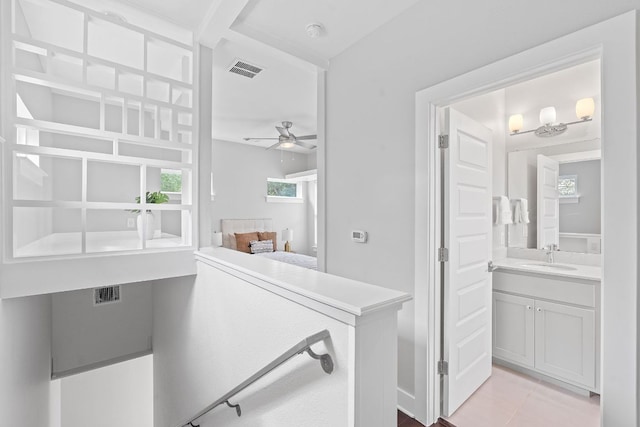 bathroom featuring ceiling fan, vanity, and tile patterned flooring