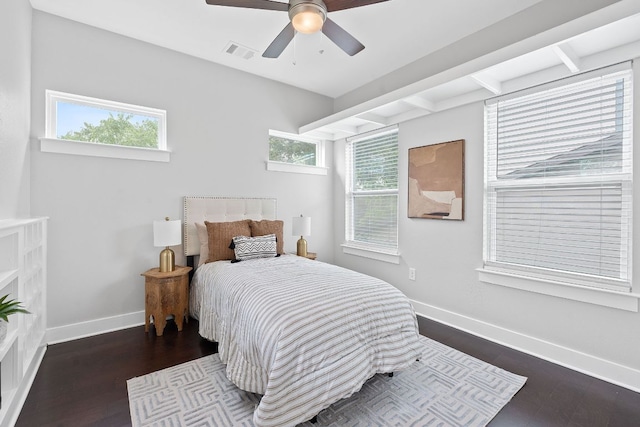 bedroom with baseboards, dark wood-type flooring, and a ceiling fan