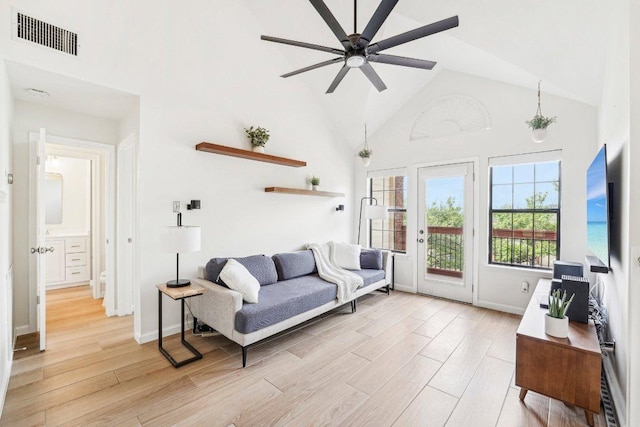 6610 Mesa Hollow Dr, Austin, TX 78750 - living room featuring high vaulted ceiling, ceiling fan, light wood-style flooring, and baseboards