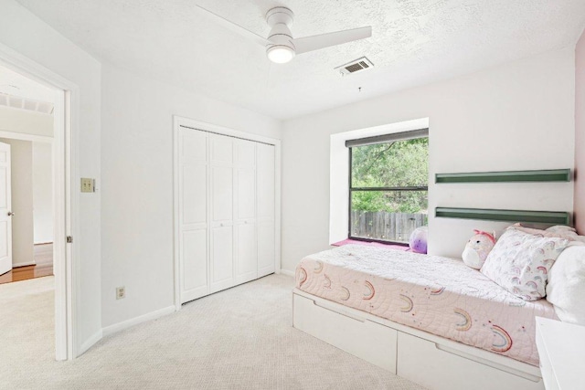 6610 Mesa Hollow Dr, Austin, TX 78750 - bedroom with carpet floors, baseboards, a closet, and ceiling fan