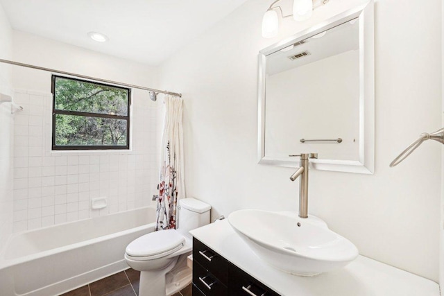 6610 Mesa Hollow Dr, Austin, TX 78750 - bathroom featuring vanity, shower / bathtub combination with curtain, toilet, and tile patterned floors