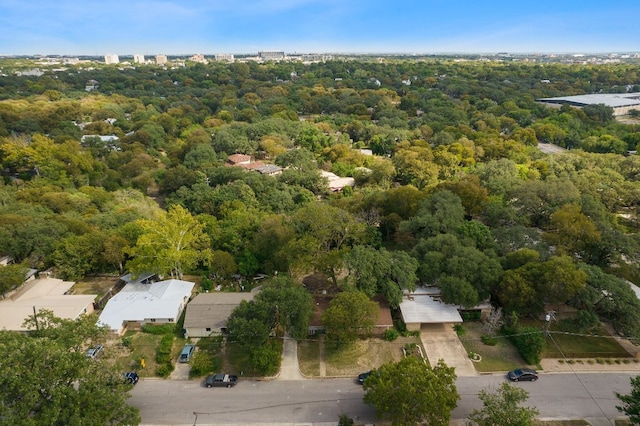 birds eye view of property with a view of trees