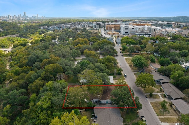 birds eye view of property with a view of city