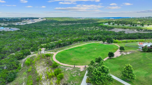 drone / aerial view with a wooded view
