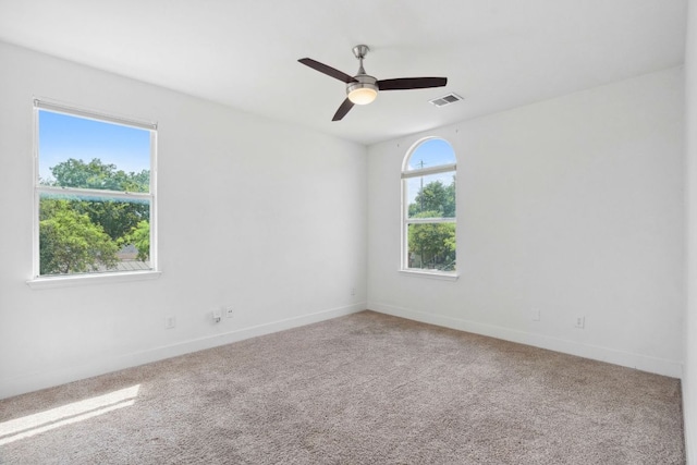7617 Carver Ave Unit 1, Austin, TX 78752 - empty room featuring a ceiling fan, baseboards, and carpet floors
