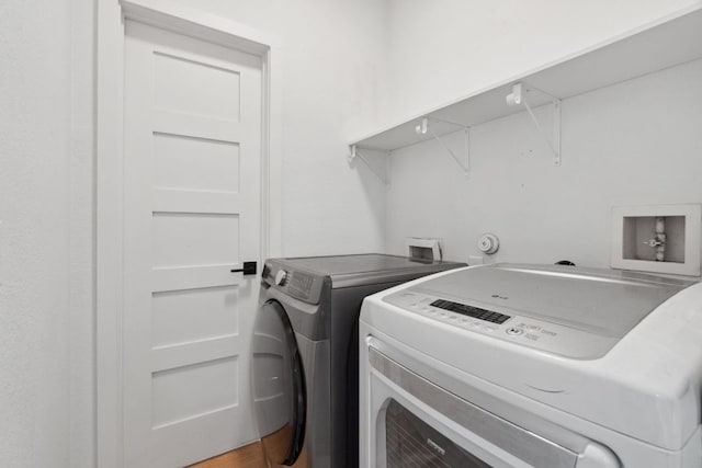 7617 Carver Ave Unit 1, Austin, TX 78752 - laundry area with washing machine and clothes dryer