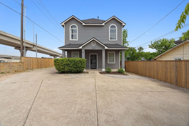 7617 Carver Ave Unit 1, Austin, TX 78752 - traditional home with a shingled roof and a porch
