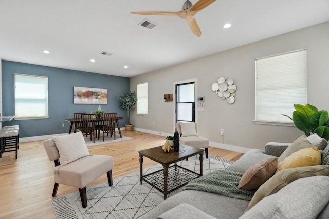 7617 Carver Ave Unit 1, Austin, TX 78752 - living room with light wood-style floors, a ceiling fan, recessed lighting, and baseboards