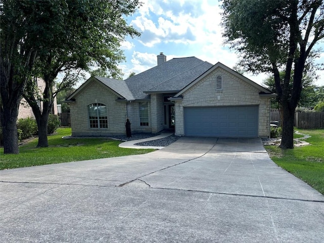 ranch-style house featuring a front lawn, stone siding, concrete driveway, fence, and a garage