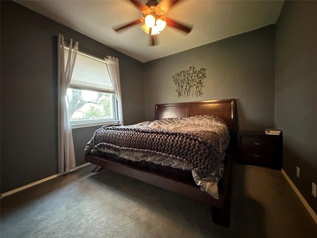 bedroom featuring carpet floors, baseboards, and ceiling fan