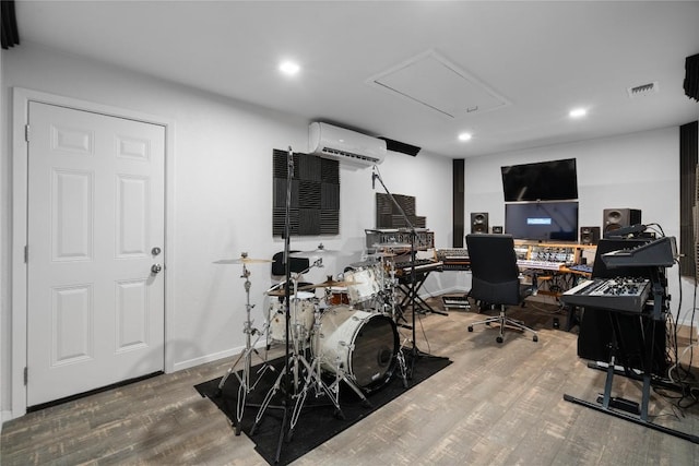 11311 Aloysia Dr, Austin, TX 78748 - home office with a wall unit AC, wood finished floors, and recessed lighting