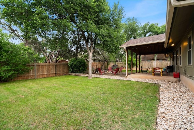 view of yard with a fenced backyard and a patio area