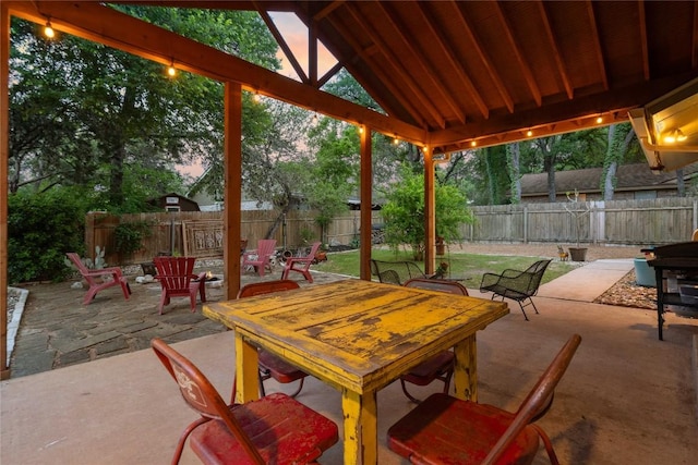view of patio / terrace with a fenced backyard and a fire pit