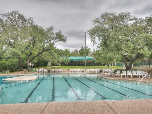 community pool featuring fence