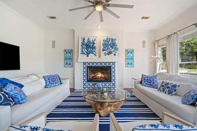 4014 Walnut Clay Dr, Austin, TX 78731 - living room featuring ceiling fan, a fireplace, and ornamental molding