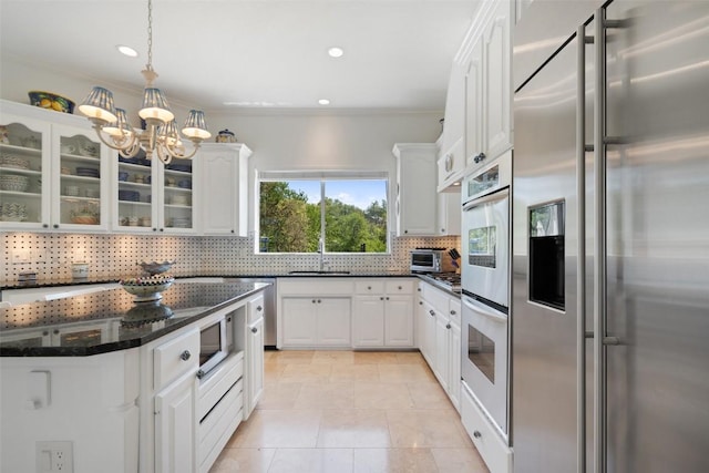4014 Walnut Clay Dr, Austin, TX 78731 - kitchen featuring stainless steel built in fridge, white cabinetry, crown molding, and recessed lighting