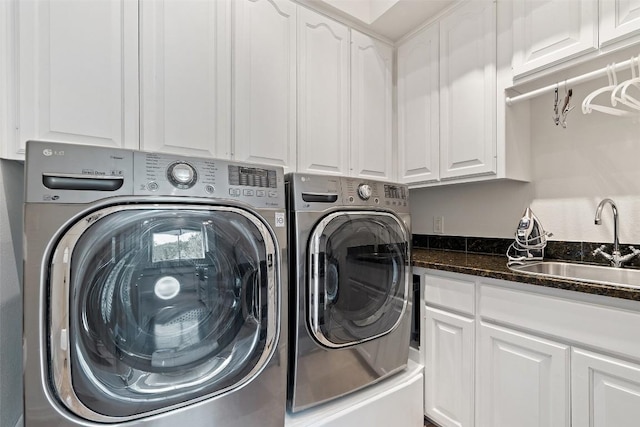 4014 Walnut Clay Dr, Austin, TX 78731 - laundry area with washing machine and clothes dryer and cabinet space