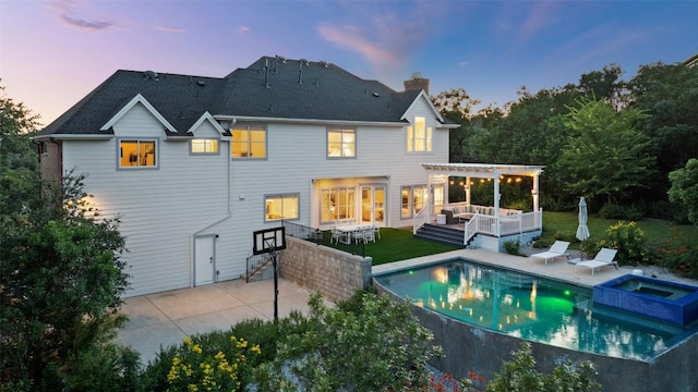 4014 Walnut Clay Dr, Austin, TX 78731 - back of property at dusk featuring a pergola, a chimney, a lawn, and a patio