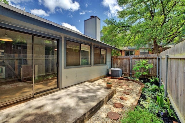 view of patio with fence and central AC