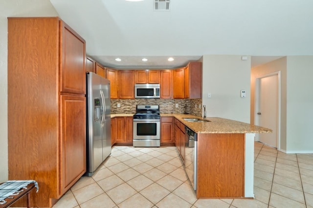 kitchen featuring a peninsula, visible vents, appliances with stainless steel finishes, and light tile patterned floors