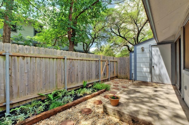 view of yard featuring a patio and a fenced backyard