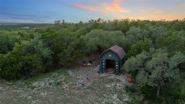 16016 Palomino Ranch Dr, Leander, TX 78641 - aerial view at dusk of a wooded view