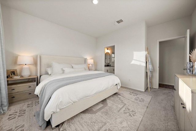 370 Grace Lilly Dr, Buda, TX 78610 - bedroom featuring light carpet, baseboards, and connected bathroom