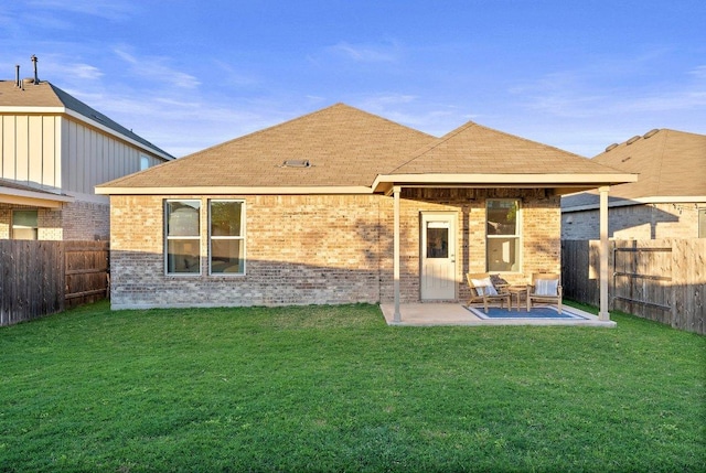 370 Grace Lilly Dr, Buda, TX 78610 - rear view of property with brick siding, a patio, and roof with shingles