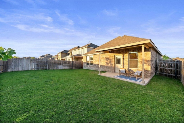 370 Grace Lilly Dr, Buda, TX 78610 - back of house featuring brick siding and a patio
