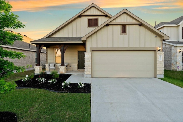 370 Grace Lilly Dr, Buda, TX 78610 - craftsman house featuring board and batten siding, a garage, driveway, a porch, and stone siding