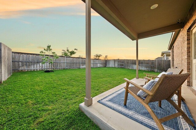 370 Grace Lilly Dr, Buda, TX 78610 - yard at dusk with a patio