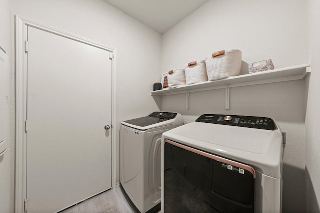 370 Grace Lilly Dr, Buda, TX 78610 - laundry area with independent washer and dryer and light wood-type flooring