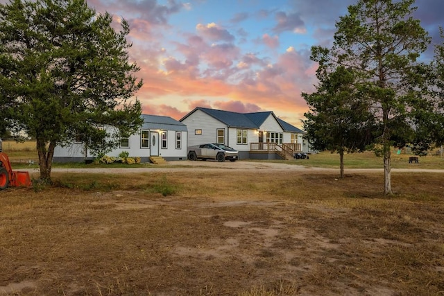 view of front of home with a lawn