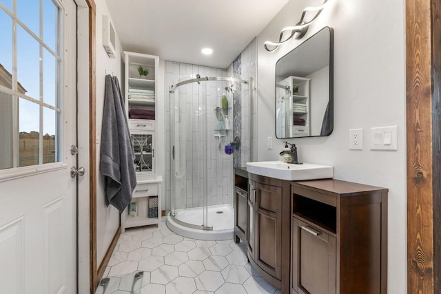 full bathroom featuring tile patterned floors, vanity, recessed lighting, and a shower stall