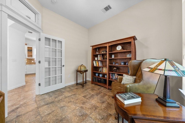 sitting room featuring baseboards and visible vents