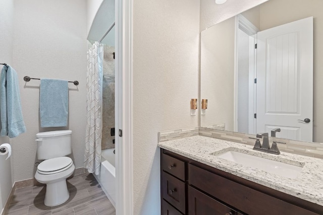 bathroom with shower / bathtub combination with curtain, wood finished floors, toilet, vanity, and baseboards
