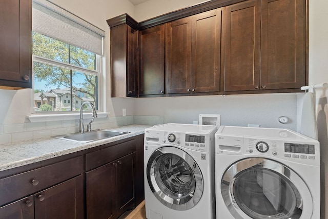 101 Dakota Dr, Georgetown, TX 78633 - laundry room with independent washer and dryer and cabinet space