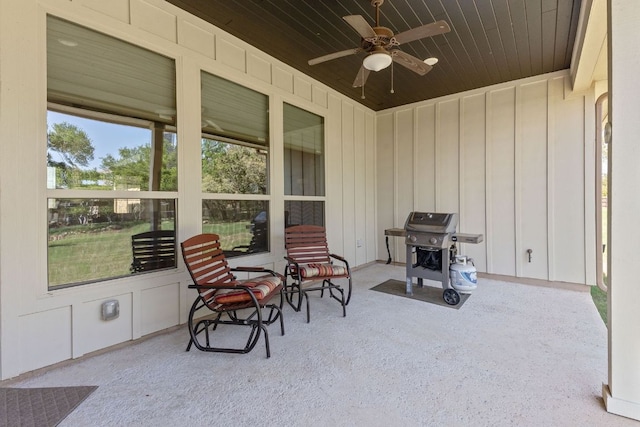 view of patio with a grill and a ceiling fan