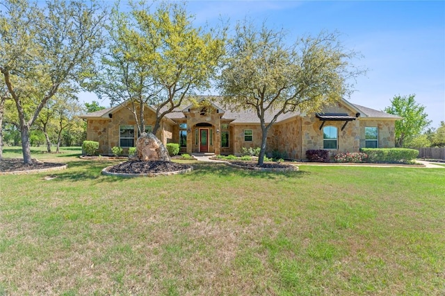 101 Dakota Dr, Georgetown, TX 78633 - view of front of property with stone siding and a front lawn