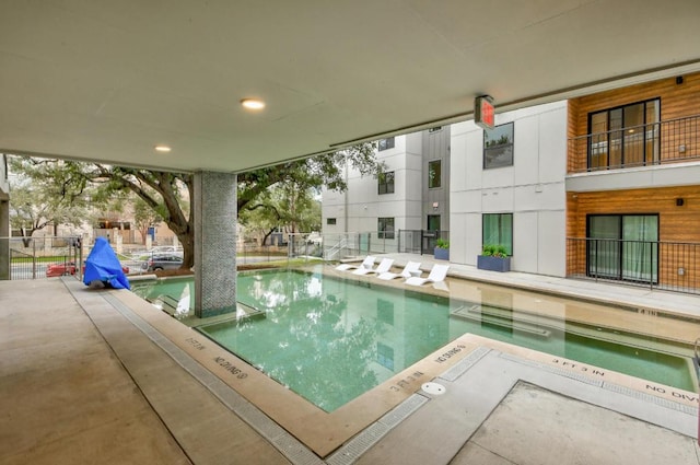 community pool featuring fence