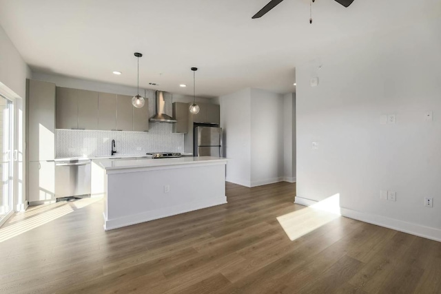 2500 Longview St Unit 501, Austin, TX 78705 - kitchen featuring stainless steel appliances, wall chimney range hood, gray cabinetry, backsplash, and recessed lighting