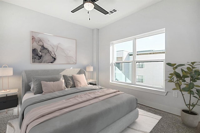 bedroom with baseboards, visible vents, carpet flooring, and ceiling fan
