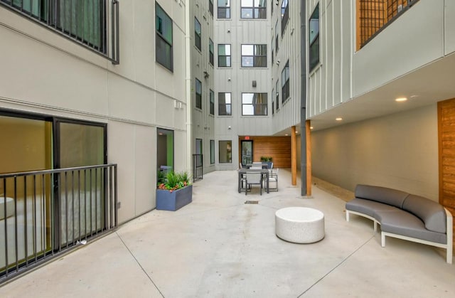view of home's community featuring outdoor dining area and a patio area