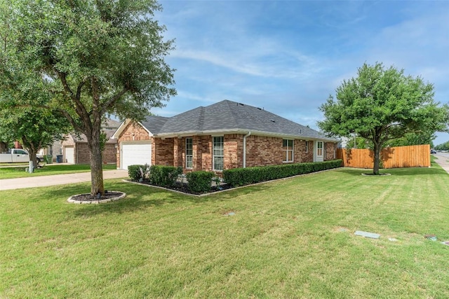 129 Aguilar Dr, Hutto, TX 78634 - view of front of property with driveway, brick siding, an attached garage, and a shingled roof