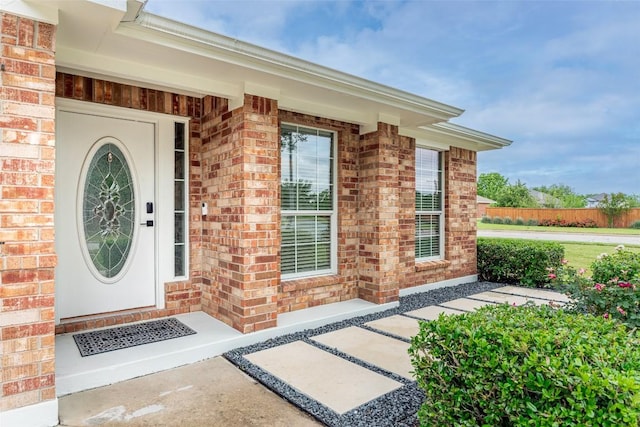 129 Aguilar Dr, Hutto, TX 78634 - doorway to property with brick siding