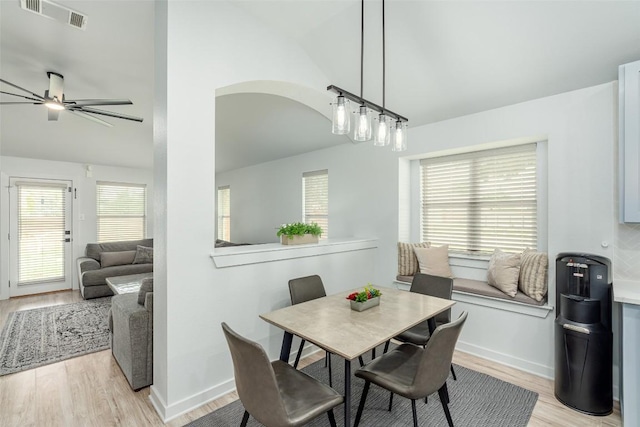 129 Aguilar Dr, Hutto, TX 78634 - dining room featuring lofted ceiling, light wood finished floors, and a ceiling fan
