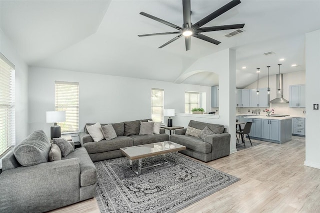 129 Aguilar Dr, Hutto, TX 78634 - living area with vaulted ceiling, light wood-type flooring, and ceiling fan