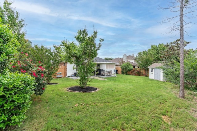 129 Aguilar Dr, Hutto, TX 78634 - view of yard featuring a storage shed and a patio area