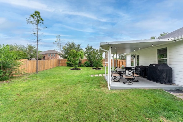 129 Aguilar Dr, Hutto, TX 78634 - fenced backyard with a patio area