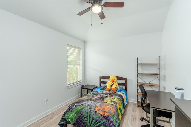 129 Aguilar Dr, Hutto, TX 78634 - bedroom with light wood-type flooring, lofted ceiling, a desk, and a ceiling fan